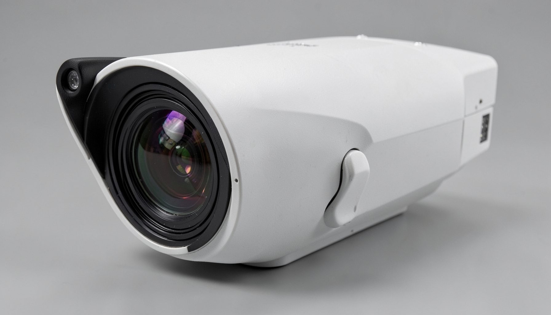 A larger security camera unit with dual lenses, shown against a neutral gray background